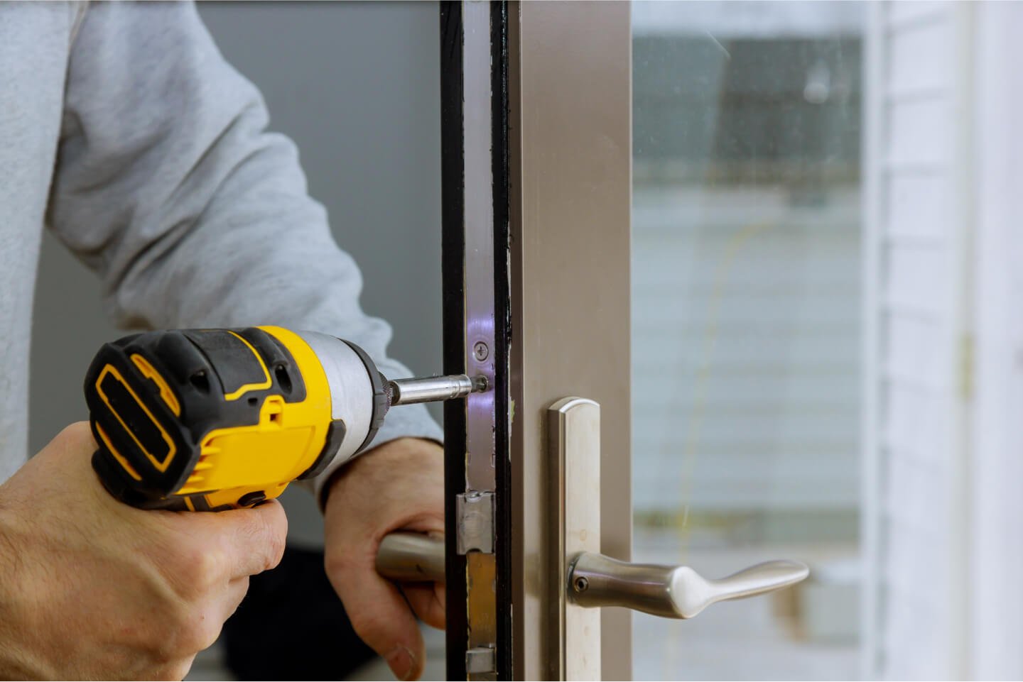 locksmith-in-installing-new-house-door-lock-hand-h-2021-08-29-01-07-52-utc.jpg
